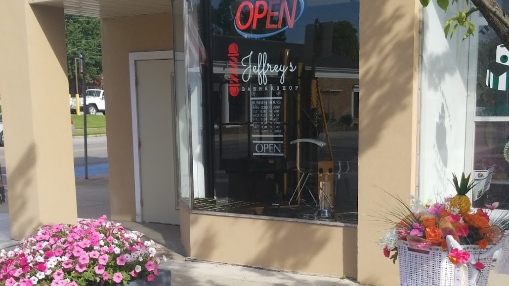 Jeffrey’s Barbershop storefront on West Washington Street, photographed in 2019